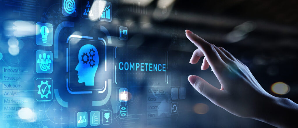COMPETENCEと書かれたデジタル表示をタッチしようとしている手